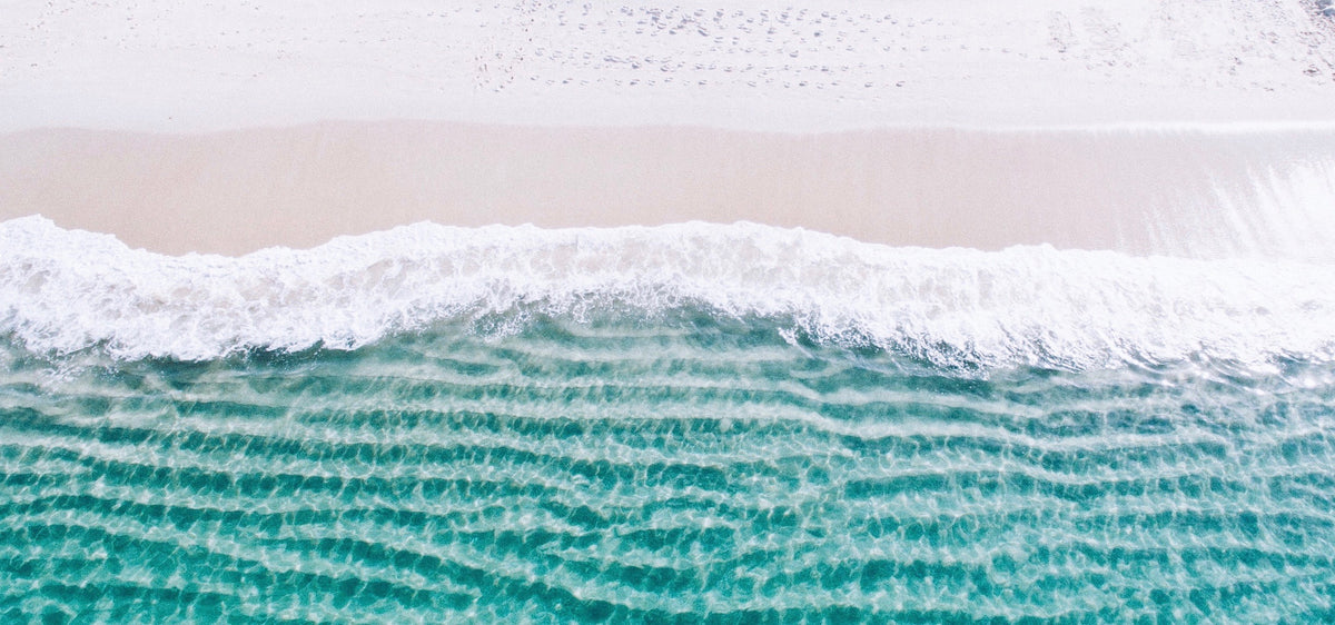 Clean white Australian beach with clear blue water